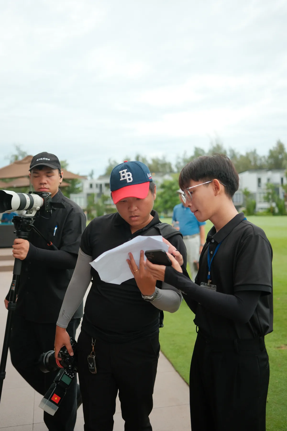 Crew reviewing the shot list on course
