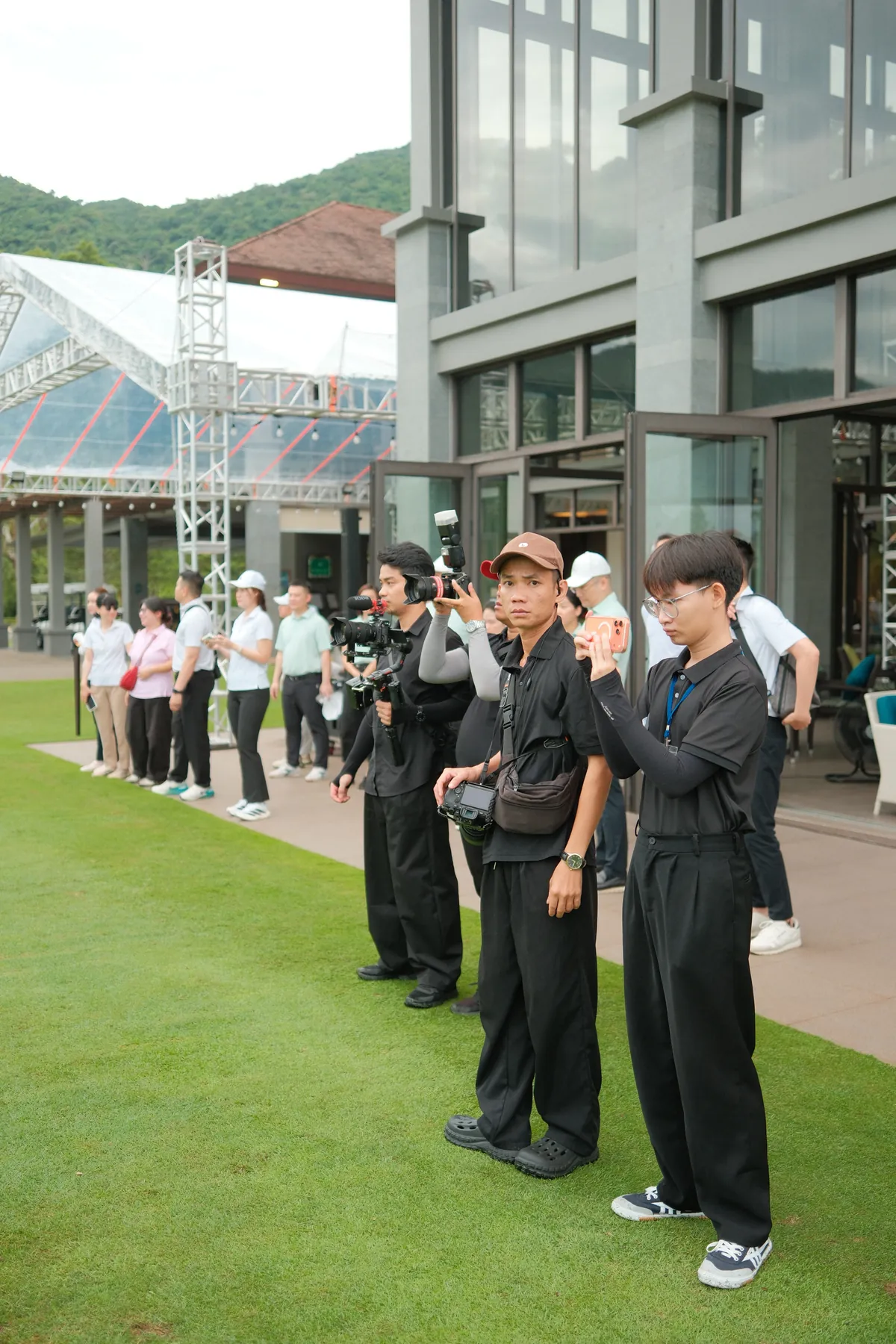Photographers holding position during the ceremony