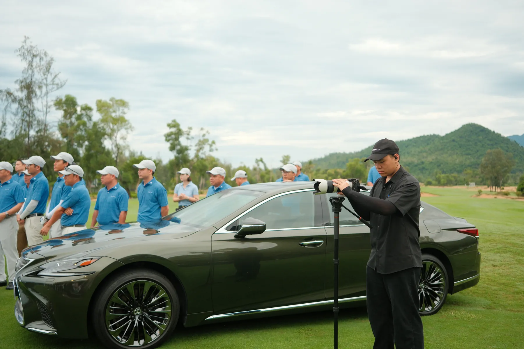 Camera operator working beside the Lexus LS 500h