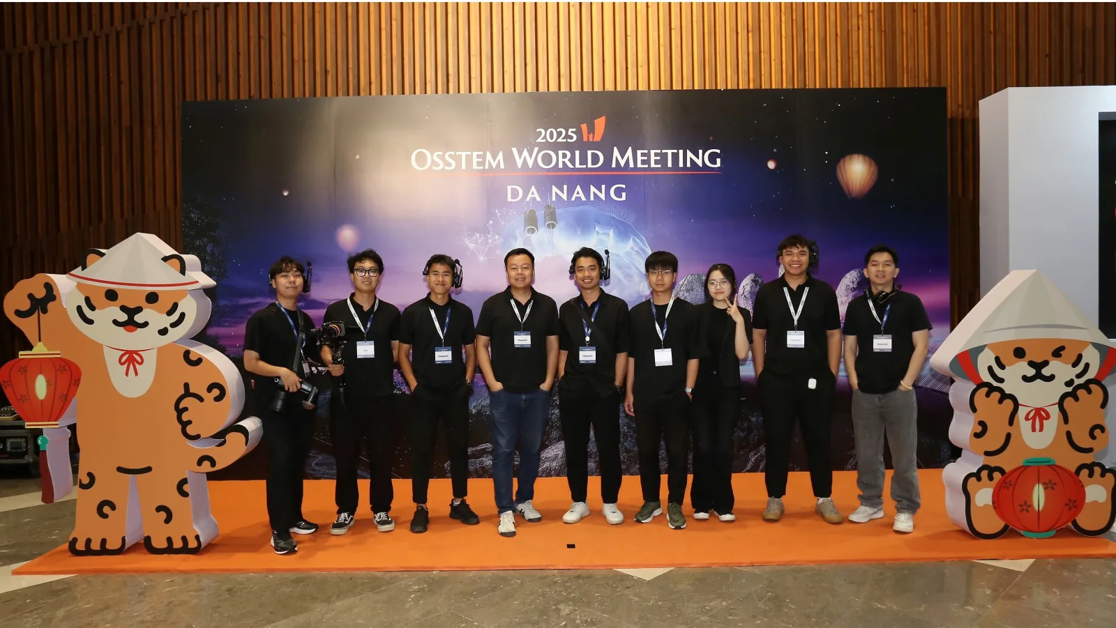 The team at the meeting backdrop